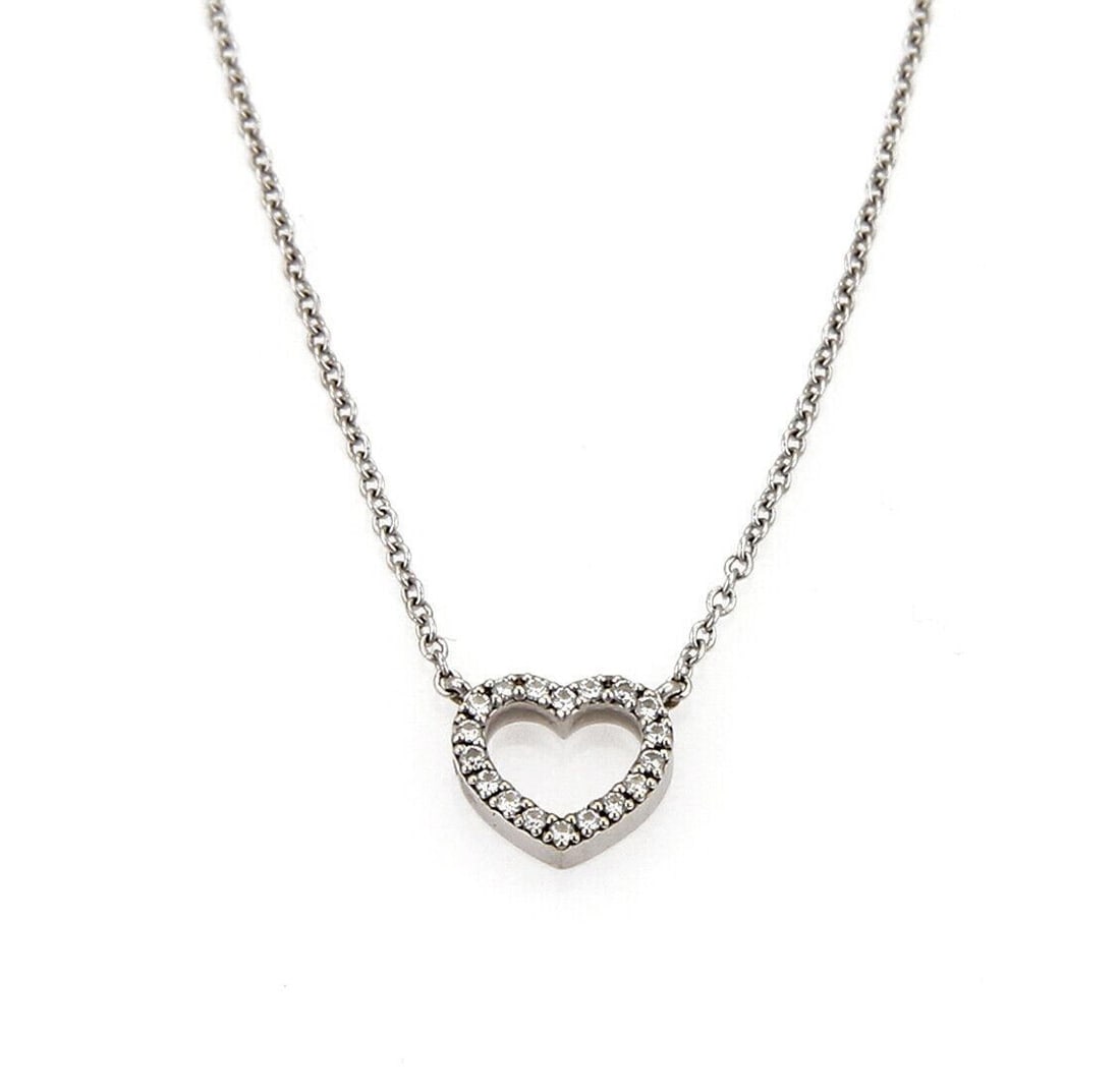 Tiffany & Co. Metro Heart Pendant Necklace in 18k White Gold Diamond: Tiffany & Co. Metro Heart Pendant Necklace in 18k White Gold Diamond This Tiffany & Co. Metro necklace features a delicate heart pendant accented with a diamond and is crafted in 18k white gold. It is