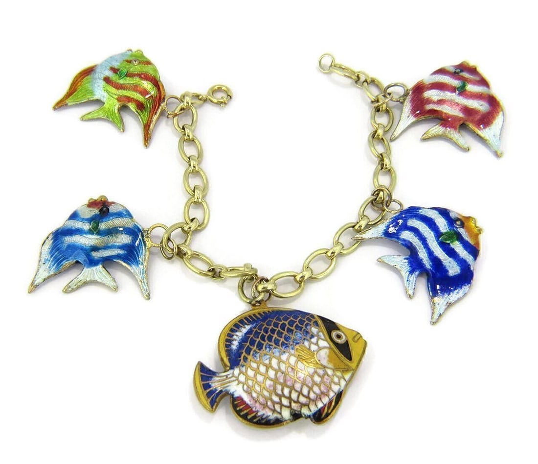 14k Yellow Gold Charm Bracelet with 5 Enamel Fish: 14k Yellow Gold Charm Bracelet with 5 Enamel Fish This vintage estate charm bracelet is crafted in solid 14k yellow gold and features five multi-color enamel fish charms. The bracelet has a polished g