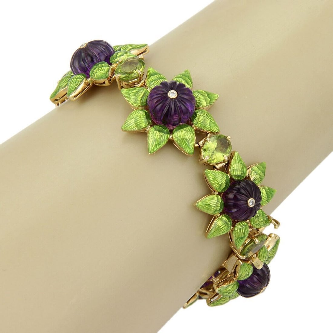 18K Yellow Gold Floral Link Bracelet with Amethyst Peridot Diamonds Enamel: 18K Yellow Gold Floral Link Bracelet with Amethyst Peridot Diamonds Enamel A vintage estate floral gemstone enamel bracelet crafted in 18k yellow gold. The design features ornate sculptural links acce