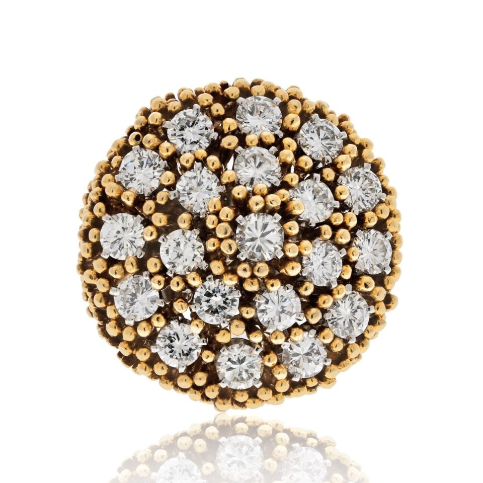 1960s Diamond Cluster Dome Ring in Platinum and 18K Gold by David Webb: 1960s Diamond Cluster Dome Ring in Platinum and 18K Gold by David Webb This striking David Webb cocktail ring from the 1960s is crafted in platinum and 18K yellow gold. The ring features a domed top a