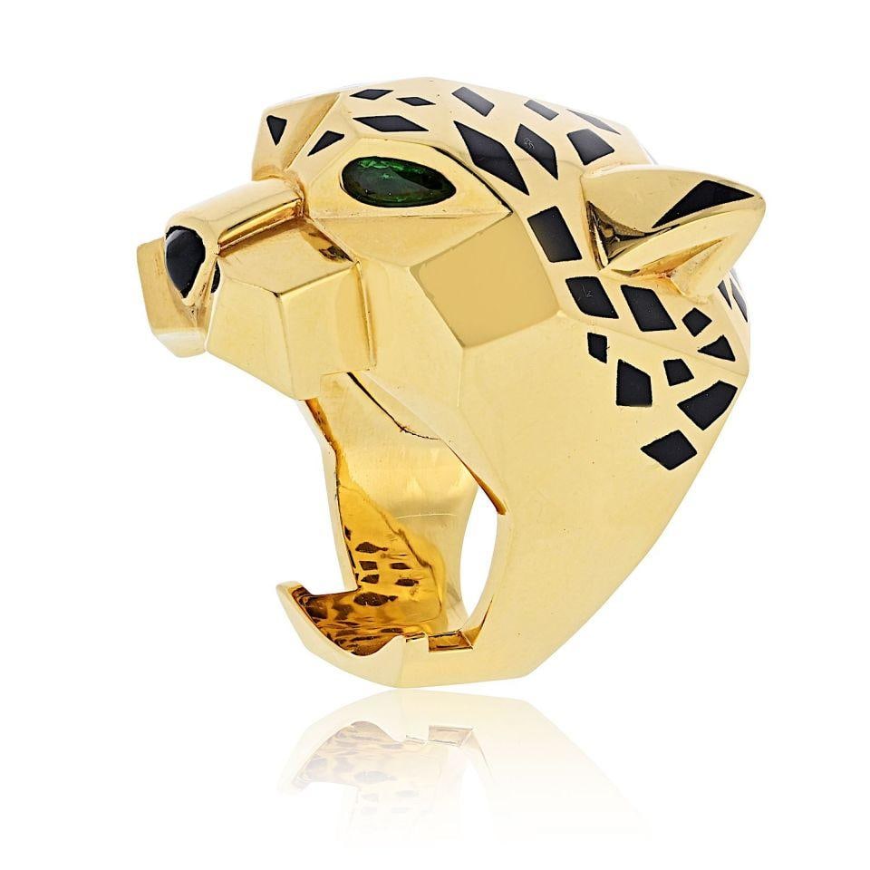 Cartier Panthere 18K Yellow Gold Ring with Peridot and Onyx: Cartier Panthere 18K Yellow Gold Ring with Peridot and Onyx This stunning Panthere de Cartier ring is an exquisite example of luxury jewelry design. Crafted from solid 18K yellow gold, this ring weigh