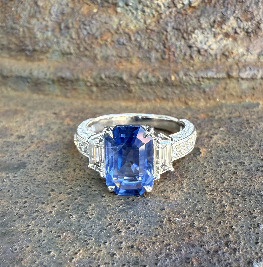 GIA Ceylon Sapphire Trapezoid Diamond 14k White Gold Cocktail Ring: GIA Ceylon Sapphire Trapezoid Diamond 14k White Gold Cocktail Ring This elegant cocktail ring features a natural, no-heat Ceylon sapphire with an elongated emerald cut, set in solid 14k white gold. Th