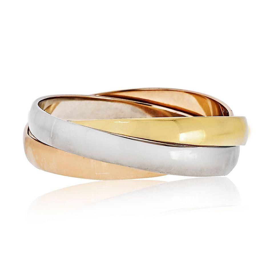 Cartier Trinity 18K Tri Color Large Roller Bracelet: Cartier Trinity 18K Tri Color Large Roller Bracelet This exquisite Cartier Trinity bracelet is crafted from luxurious 18K tri-color gold, showcasing a stunning blend of yellow, white, and rose gold. W