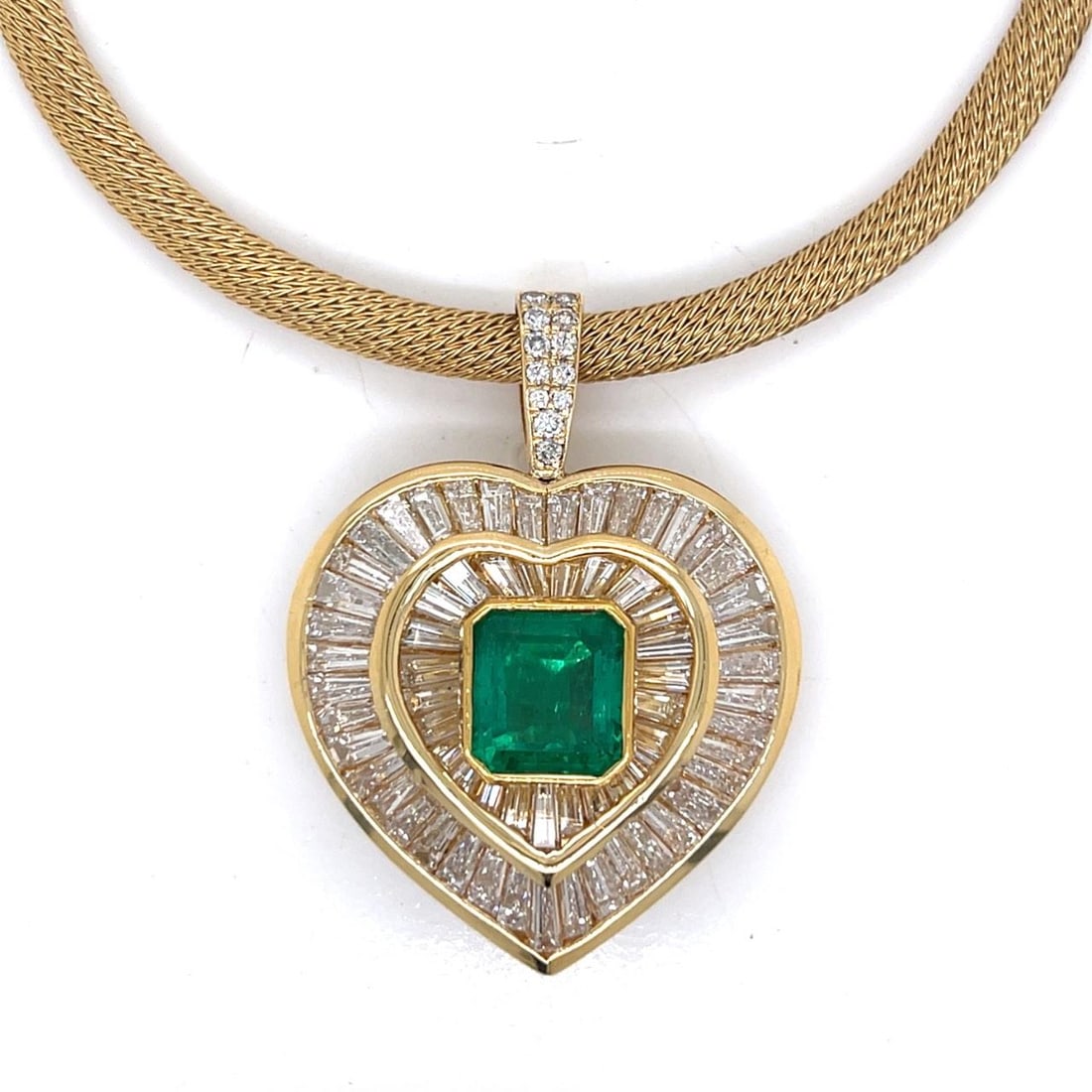 Colombian Emerald Pendant with Diamonds in 18K Yellow Gold 1.5 Inch: Colombian Emerald Pendant with Diamonds in 18K Yellow Gold 1.5 Inch This pendant is crafted from 18K yellow gold and features an approximately 4.25 carat gem-quality Colombian emerald. The pendant is 