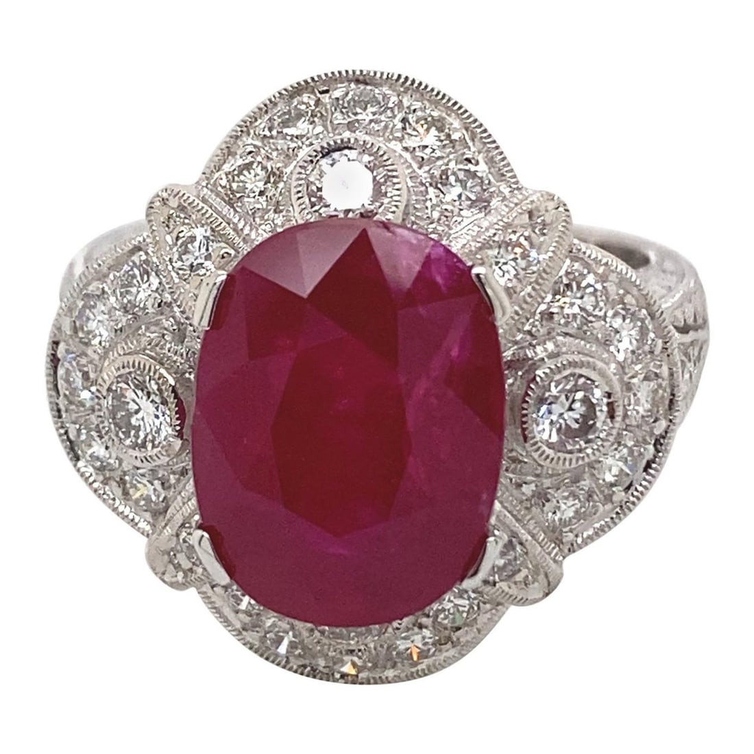 Art Deco 5.12ct Ruby Diamond Ring 18k White Gold GIA Appraisal: Art Deco 5.12ct Ruby Diamond Ring 18k White Gold GIA Appraisal This stunning Art Deco style ring features a captivating 5.12 carat oval ruby at its center, beautifully complemented by 0.99 carats of r
