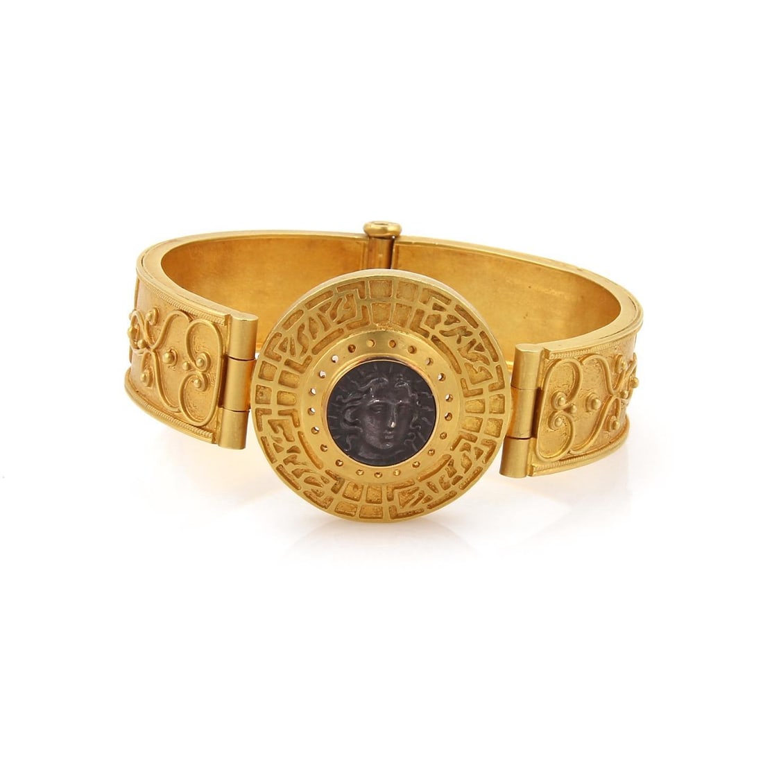 22k Yellow Gold Fancy Medallion Coin Bracelet Artisan Design: 22k Yellow Gold Fancy Medallion Coin Bracelet Artisan Design This stunning bracelet is crafted from 22k yellow gold, showcasing a beautiful polished and satin finish. The centerpiece features a 1.27" 