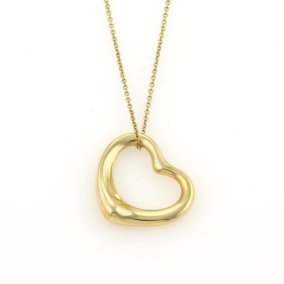 Tiffany & Co. Elsa Peretti Open Heart Pendant 18k Yellow Gold Chain: Tiffany & Co. Elsa Peretti Open Heart Pendant 18k Yellow Gold Chain This exquisite Tiffany & Co. pendant and chain, designed by Elsa Peretti, is crafted from authentic 18k yellow gold. The pendant sho