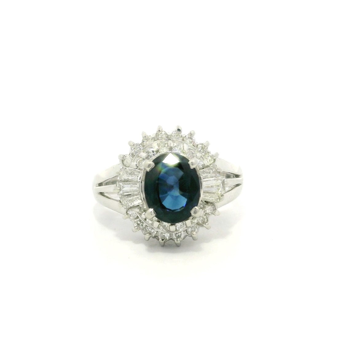 Platinum 1.77ctw Oval Blue Sapphire Diamond Dual Halo Cocktail Ring: Platinum 1.77ctw Oval Blue Sapphire Diamond Dual Halo Cocktail Ring This exquisite cocktail ring features a stunning 1.77ctw oval deep blue sapphire, elegantly surrounded by a dual halo of diamonds. T