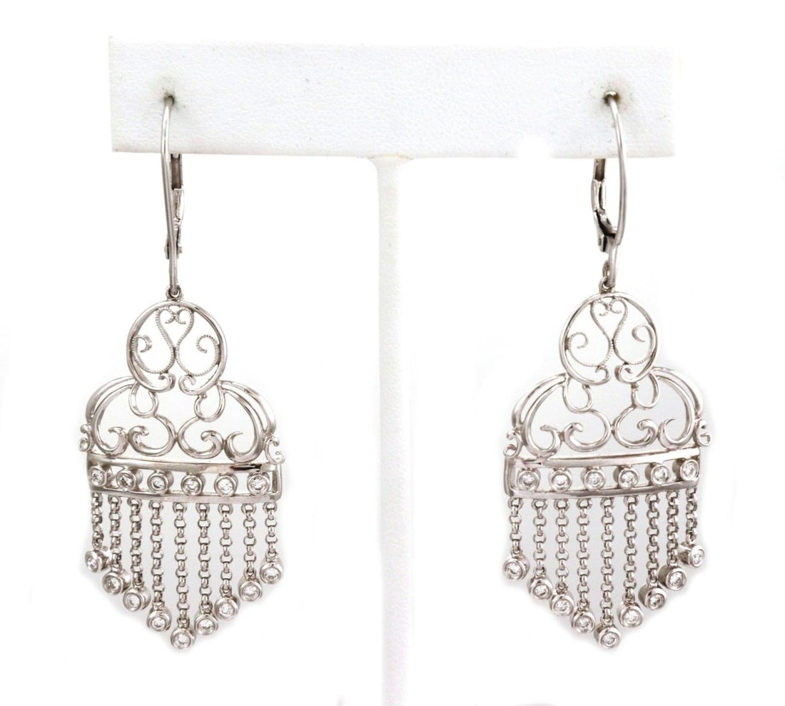 Elegant Estate 14k White Gold Diamond Chandelier Earrings: Elegant Estate 14k White Gold Diamond Chandelier Earrings Elevate your elegance with these stunning Estate Diamond Chandelier Earrings, expertly crafted from 14k white gold. The earrings feature a pol
