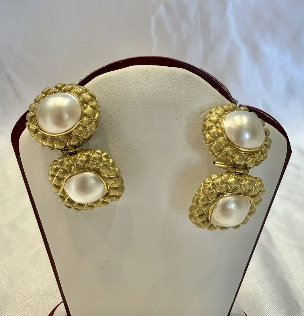French 14K Yellow Gold Mabe Pearl Chandelier Earrings: French 14K Yellow Gold Mabe Pearl Chandelier Earrings This exquisite pair of earrings showcases the elegance of French craftsmanship with 14k yellow gold and stunning mabe pearls. The chandelier style