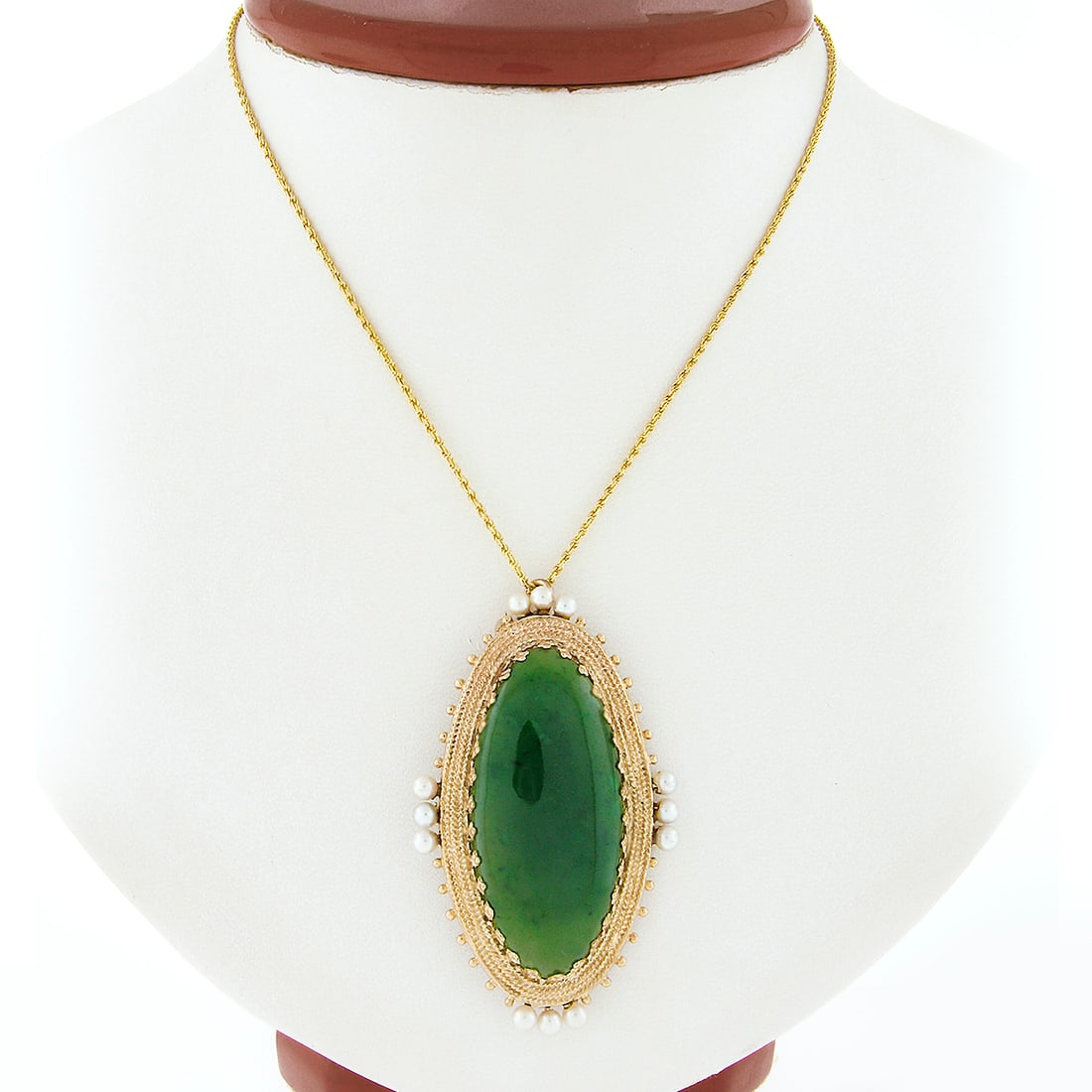 Vintage 14k Yellow Gold Jade Pearl Brooch Pendant with Rope Chain: Vintage 14k Yellow Gold Jade Pearl Brooch Pendant with Rope Chain This exquisite vintage brooch pendant showcases a stunning large elongated oval cabochon jade set in solid 14k yellow gold. The jade, 