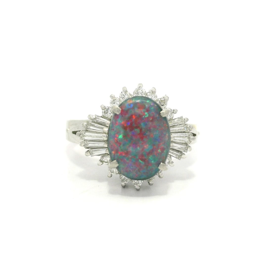 Vintage Platinum 1.66ctw GIA Black Opal & Diamond Cocktail Ring: Vintage Platinum 1.66ctw GIA Black Opal & Diamond Cocktail Ring This stunning vintage cocktail ring features a remarkable 1.66ctw black opal with captivating red and blue color play, elegantly complem