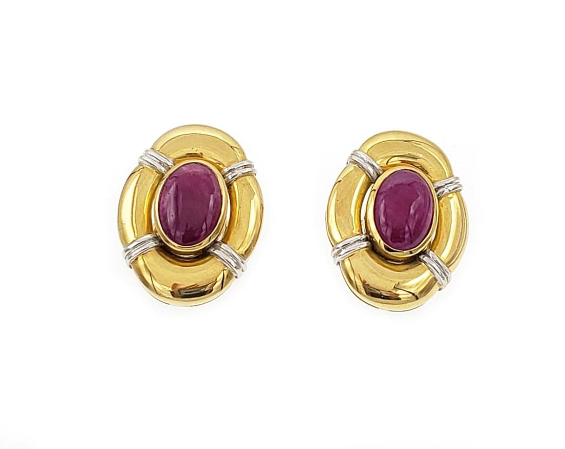 Vintage 7ct Oval Ruby 14k Gold Huggie Earrings with Omega Backs: Vintage 7ct Oval Ruby 14k Gold Huggie Earrings with Omega Backs Elegantly designed, these vintage huggie earrings are crafted from 14k yellow and white gold, featuring a striking long oval shape. The 