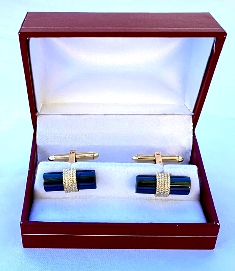 14K Yellow Gold Hematite Cufflinks with Hallmark Signature: 14K Yellow Gold Hematite Cufflinks with Hallmark Signature Elevate your formal attire with this exquisite pair of cufflinks crafted from 14K yellow gold featuring stunning hematite stones. Each cuffli