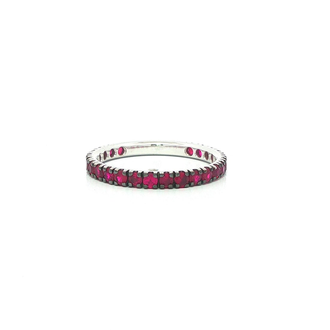 18k White Gold Ruby Eternity Stack Ring Black Rhodium Sz 6.5: 18k White Gold Ruby Eternity Stack Ring Black Rhodium Sz 6.5 This elegant eternity stack band ring features numerous genuine deep red rubies in a round brilliant cut, pave set to create a continuous d