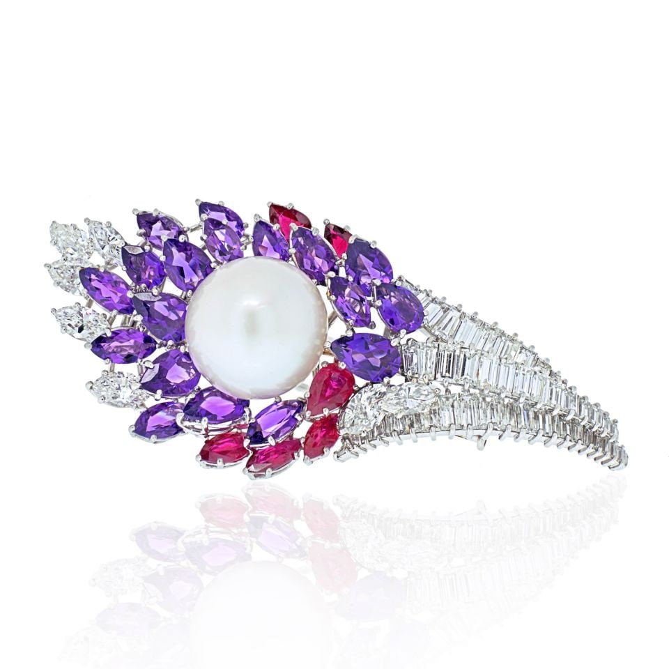 David Webb 18K White Gold Diamond Ruby Amethyst Pearl Brooch: David Webb 18K White Gold Diamond Ruby Amethyst Pearl Brooch This stunning David Webb brooch is a masterpiece crafted in 18K white gold, weighing 34.7 grams. It features a captivating design set with 