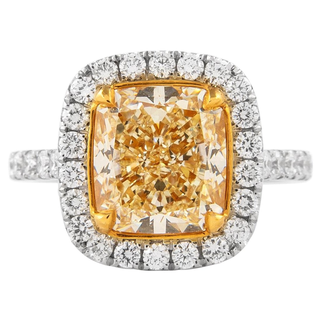 3.30ct Fancy Yellow Diamond Halo Ring 18k: 3.30ct Fancy Yellow Diamond Halo Ring 18k Introducing a stunning 3.30ct Fancy Yellow Diamond Ring, beautifully crafted in 18k two-tone gold. This exquisite piece features a cushion cut Fancy Yellow di