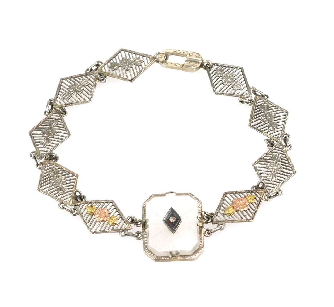14k Tri Color Gold Camphor Glass Link Bracelet with Diamond Accents: 14k Tri Color Gold Camphor Glass Link Bracelet with Diamond Accents This vintage estate bracelet is crafted in 14k rose, yellow, and white gold with camphor glass panels and diamond accents. It featur