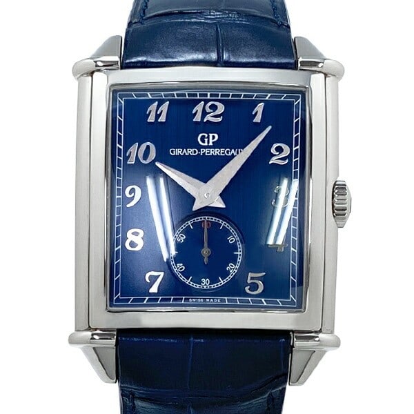 Vintage 1945 Blue Dial Automatic Small Seconds Wristwatch: Vintage 1945 Blue Dial Automatic Small Seconds Wristwatch This Girard Perregaux Vintage 1945 XXL Small Seconds wristwatch features a stainless steel case paired with a blue alligator leather bracelet 