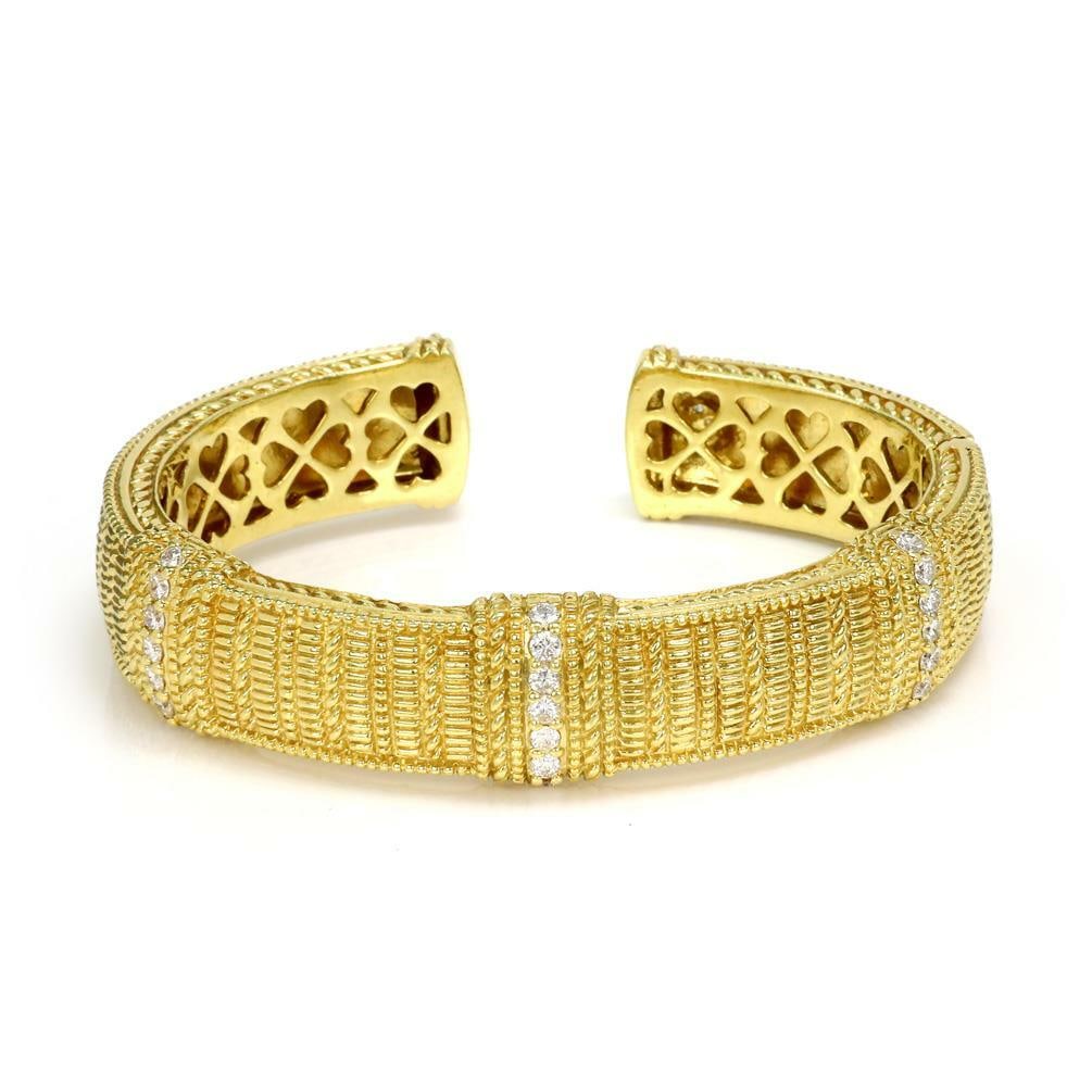 Judith Ripka 18k Yellow Gold Cuff Bracelet with 1.15ct Diamonds: Judith Ripka 18k Yellow Gold Cuff Bracelet with 1.15ct Diamonds This exquisite bracelet from Judith Ripka is a stunning piece crafted from 18k yellow gold, showcasing a textured finish. The cuff featu
