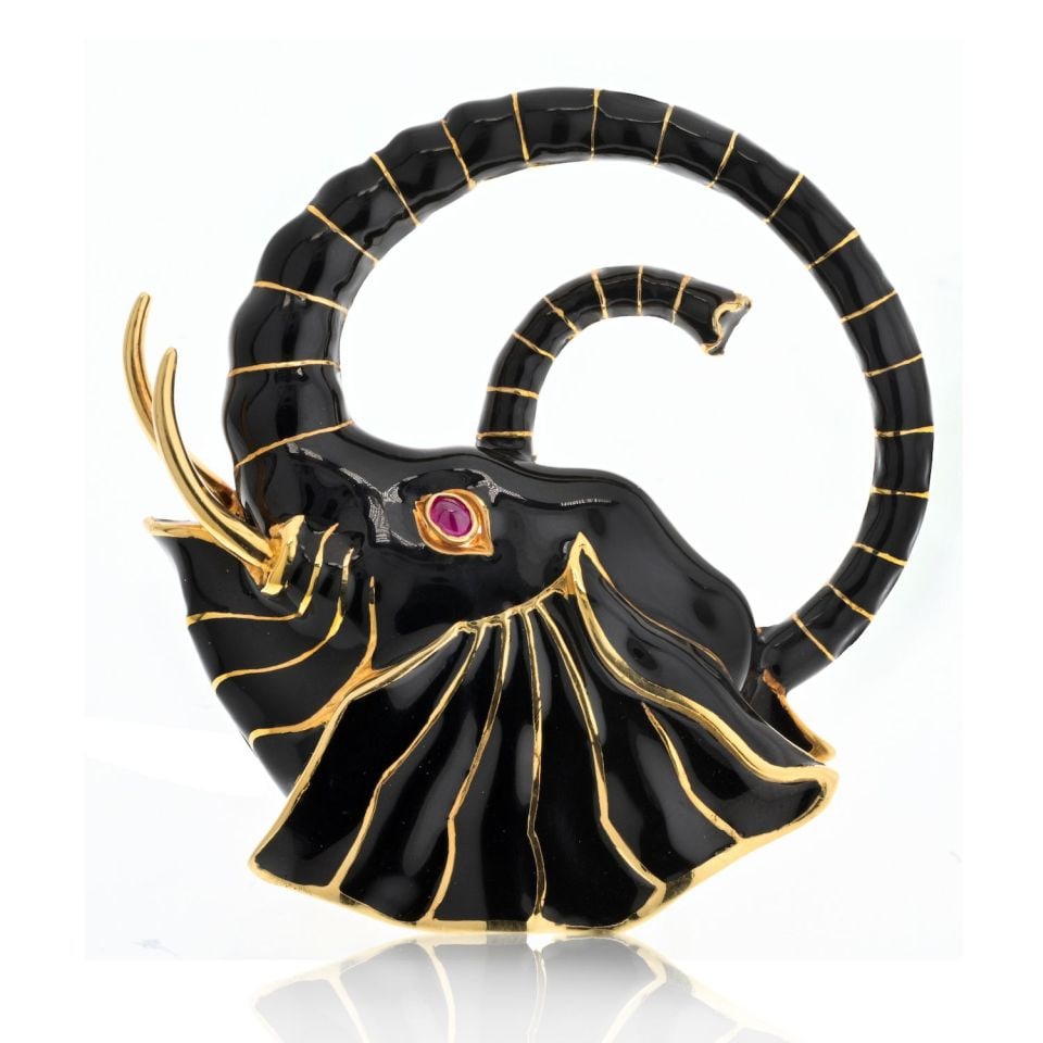 David Webb Platinum 18K Gold Black Enamel Elephant Brooch with Ruby Eye: David Webb Platinum 18K Gold Black Enamel Elephant Brooch with Ruby Eye Experience the grandeur of wildlife with the David Webb Platinum & 18K Yellow Gold Black Enamel Elephant Brooch. This stunning b