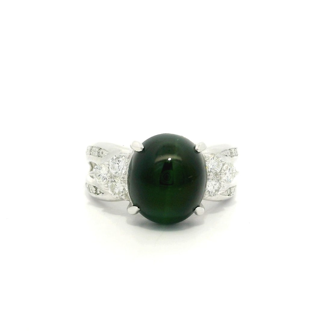 GIA Certified 5.5ct Cat's Eye Green Tourmaline Diamond Accent Platinum Ring: GIA Certified 5.5ct Cat's Eye Green Tourmaline Diamond Accent Platinum Ring This stunning cocktail ring showcases a captivating natural cat's eye deep green tourmaline, featuring a vibrant oval double