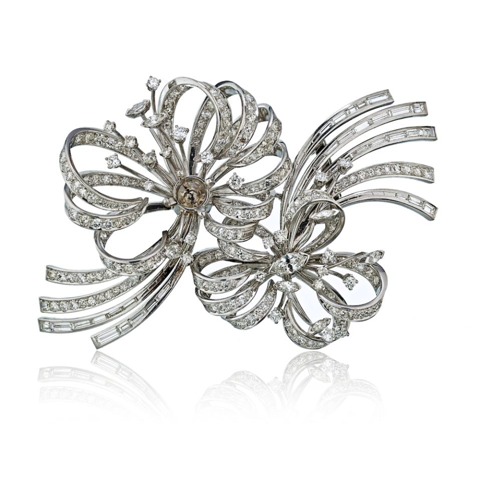 Mauboussin 1940s Platinum Diamond Double Clip Brooch 12 Cts: Mauboussin 1940s Platinum Diamond Double Clip Brooch 12 Cts This exquisite Mauboussin Double Clip Brooch, dating back to the 1940s, showcases a stunning design crafted from platinum. Weighing approxim