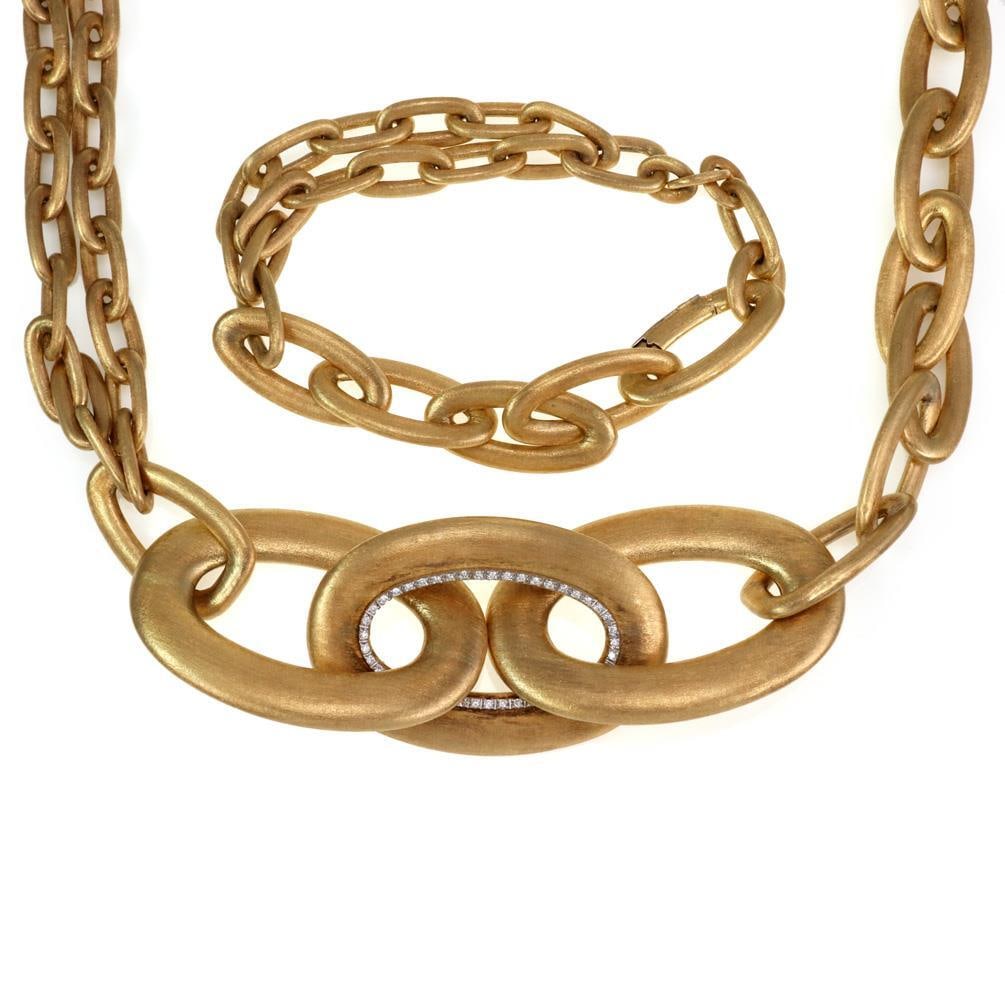 Nanis Italy 18k Gold Diamond Necklace and Bracelet Set 29" L: Nanis Italy 18k Gold Diamond Necklace and Bracelet Set 29" L Elevate your style with this exquisite necklace and bracelet set designed by the renowned Italian designer Nanis. Crafted from premium 18k 