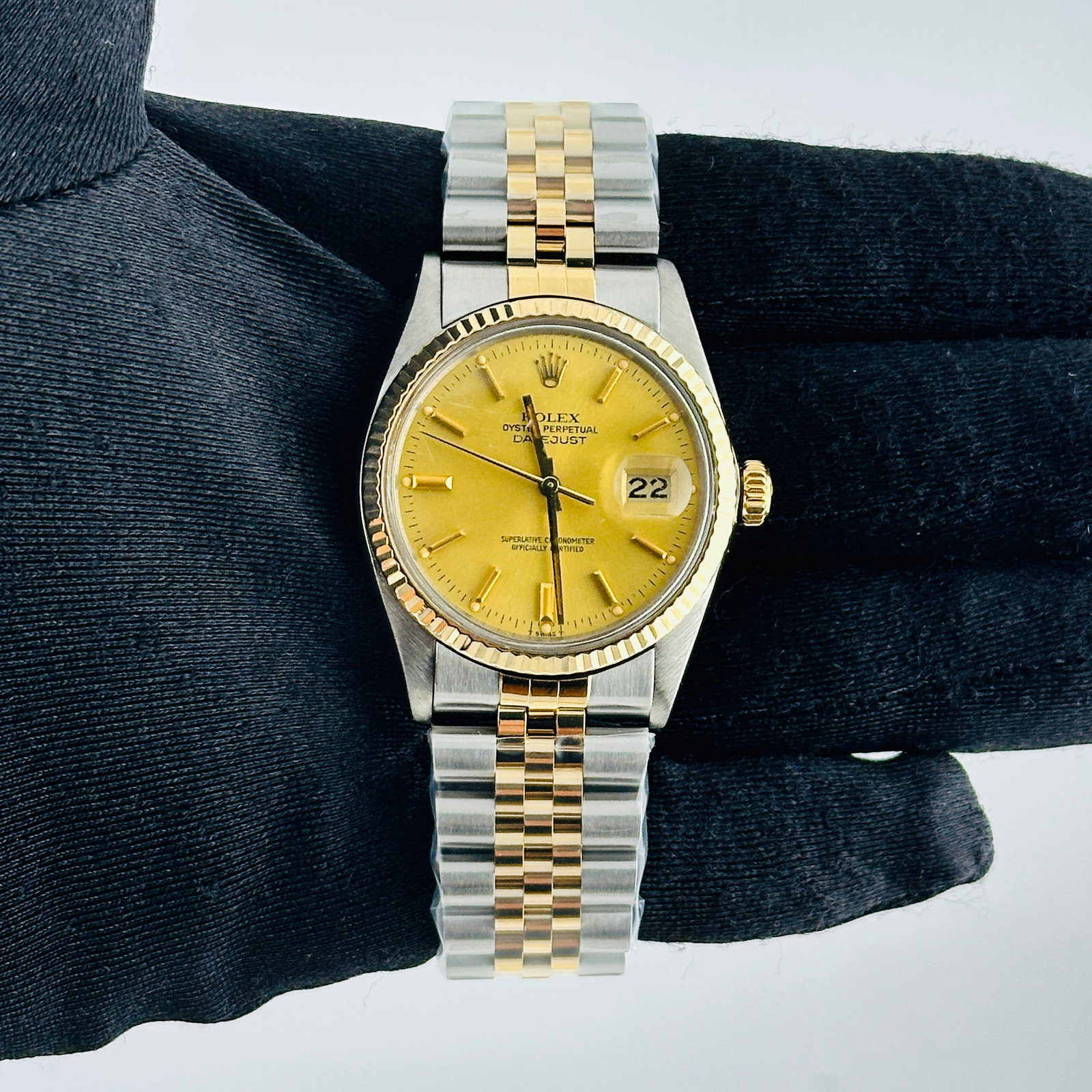 Rolex Champagne Stick Dial Datejust Ref 16013 with Aftermarket Jubilee Bracelet: Rolex Champagne Stick Dial Datejust Ref 16013 with Aftermarket Jubilee Bracelet This Rolex Datejust features a champagne stick dial and a fluted bezel, complemented by an aftermarket Jubilee bracelet.