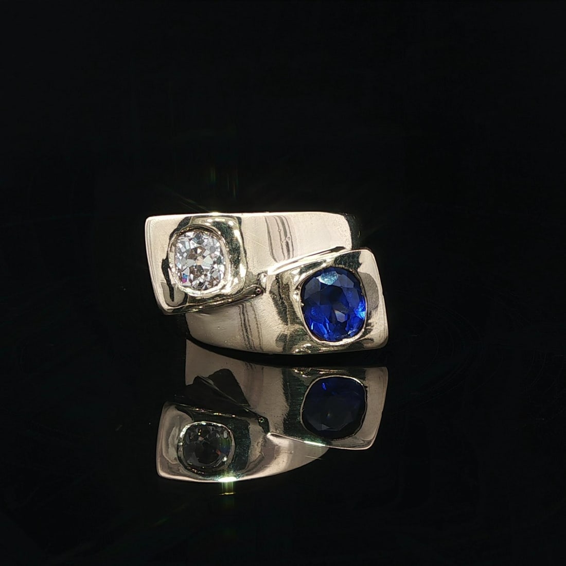 Moi Et Toi Sapphire and Diamond Bypass Ring in 14k Yellow Gold 1.52ctw: Moi Et Toi Sapphire and Diamond Bypass Ring in 14k Yellow Gold 1.52ctw This bypass Moi et Toi ring features a vivid blue natural old mine cut sapphire weighing approximately 1.0ct and an old mine cush