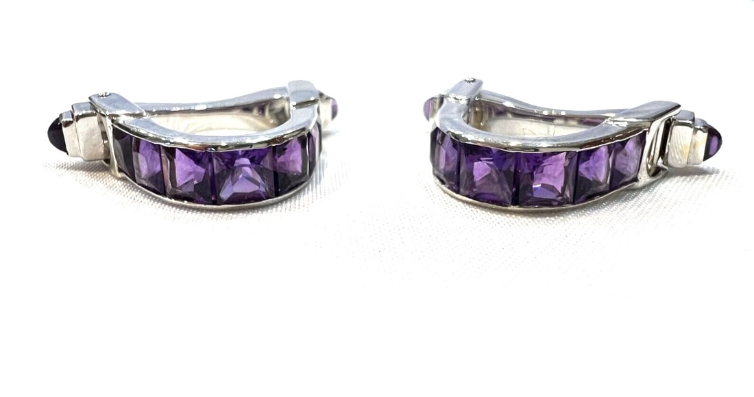 Pair of Ellie Frei 18K White Gold Amethyst Cufflinks: Pair of Ellie Frei 18K White Gold Amethyst Cufflinks A pair of Ellie Frei cufflinks in 18K white gold, featuring amethyst and diamond. Each cufflink has a release button on the side. The piece is full