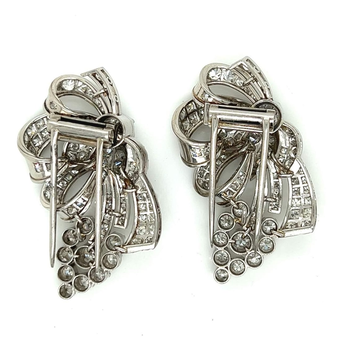 Art Deco Platinum Diamond Clip Earrings 1.20 Ct & 6.00 Ct Diamonds: Art Deco Platinum Diamond Clip Earrings 1.20 Ct & 6.00 Ct Diamonds These exquisite Art Deco Platinum Diamond Clips are a stunning addition to any jewelry collection. Weighing 31.0 grams, they are ador