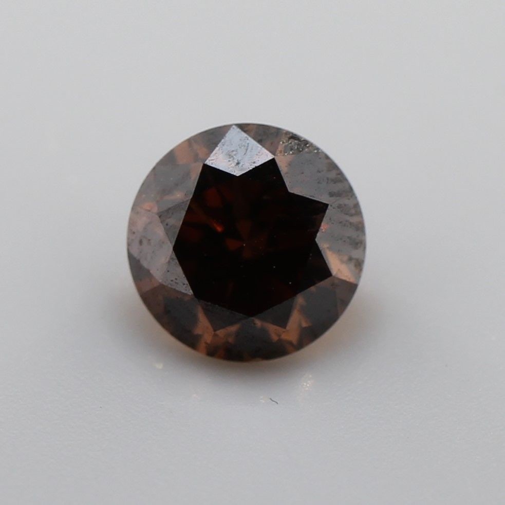 Loose Diamond - ROUND 0.69ct Fancy Dark Orangey Brown SI1: Loose Diamond - ROUND 0.69ct Fancy Dark Orangey Brown SI1 Source: Natural Shape: ROUND Carats: 0.69 Color: Fancy Dark Orangey Brown Certification: NONE The Diamond Depot Guarantee: All items in this a