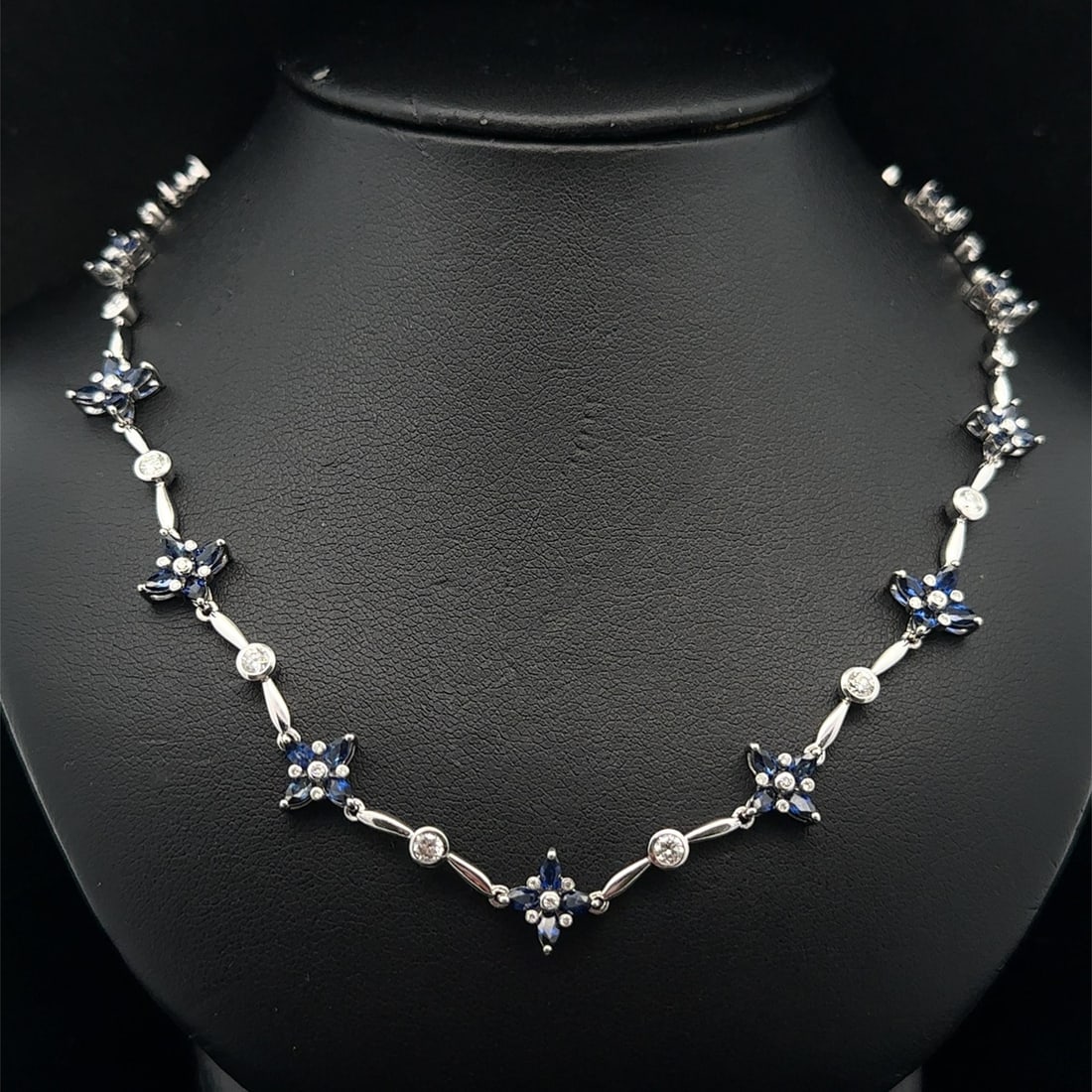 Marquise Sapphire and Diamond Platinum Four Leaf Clover Pendant Necklace: Marquise Sapphire and Diamond Platinum Four Leaf Clover Pendant Necklace This exquisite necklace features a four-leaf clover flower design adorned with approximately 68 natural marquise-cut sapphires 