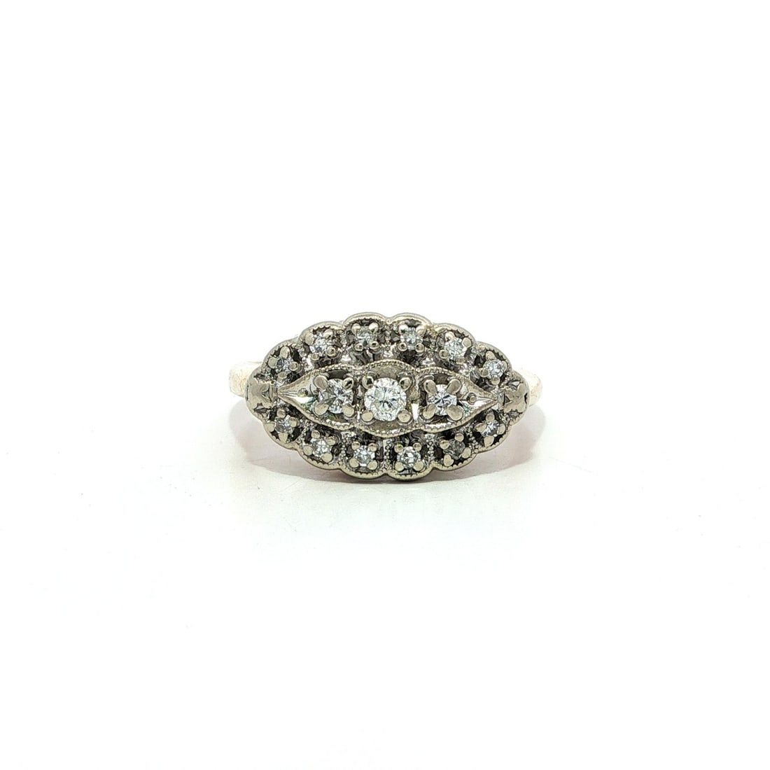 Vintage 0.30ct Diamond Filigree Marquise Cocktail Ring in Yellow Gold: Vintage 0.30ct Diamond Filigree Marquise Cocktail Ring in Yellow Gold This exquisite vintage cocktail ring features a stunning marquise shape, crafted from solid 13-14k yellow and white gold. The ring