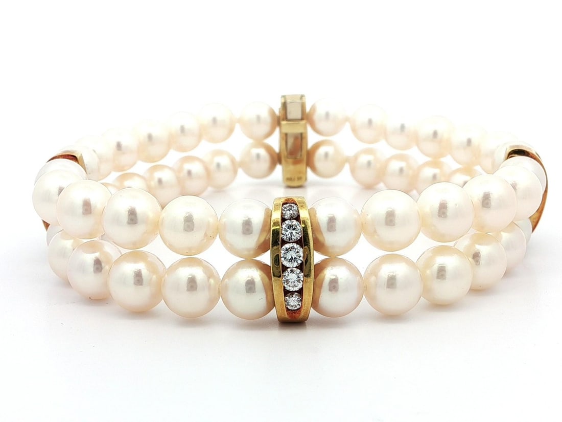 Vintage 18k Gold Dual Pearl Diamond Bracelet with Spacers: Vintage 18k Gold Dual Pearl Diamond Bracelet with Spacers This exquisite vintage bracelet features a stunning dual strand design crafted from genuine cultured pearls and adorned with natural diamonds.