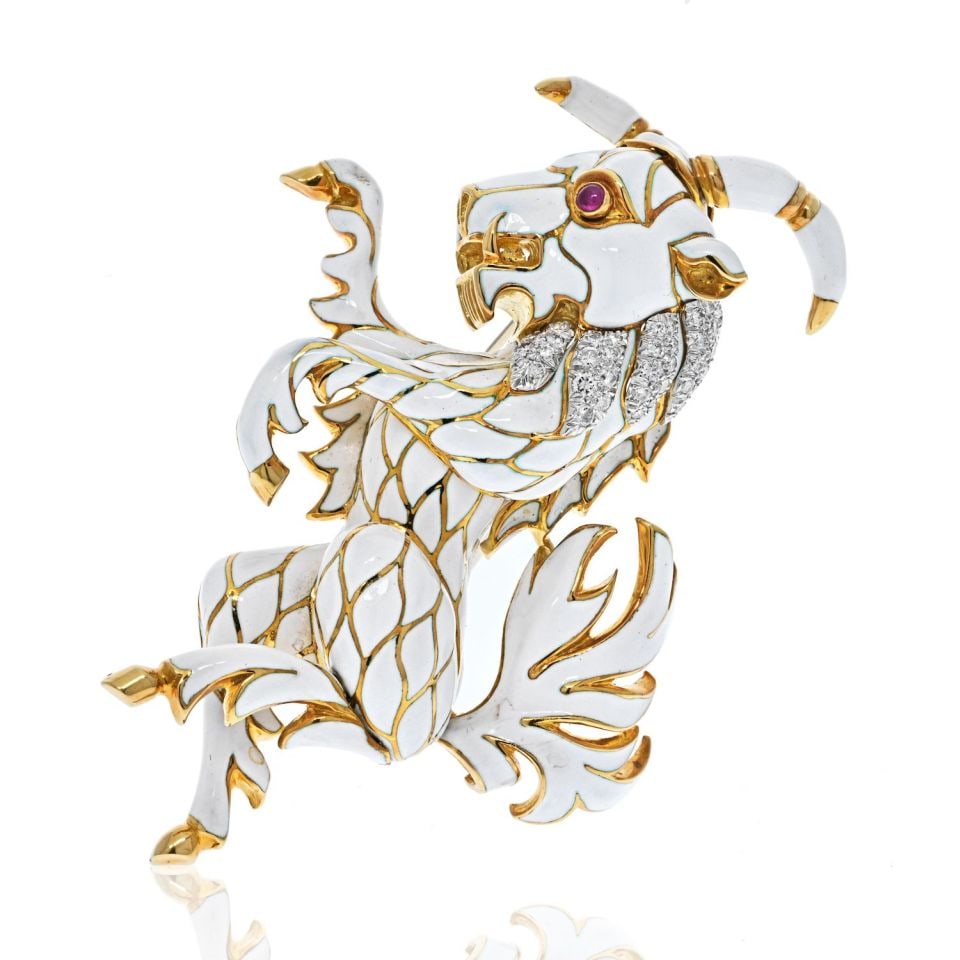 David Webb Goat Brooch Platinum 18K Yellow Gold Enamel Diamond Ruby Eyes: David Webb Goat Brooch Platinum 18K Yellow Gold Enamel Diamond Ruby Eyes This exquisite brooch features a detailed goat design crafted from a combination of platinum and 18K yellow gold. The goat is a