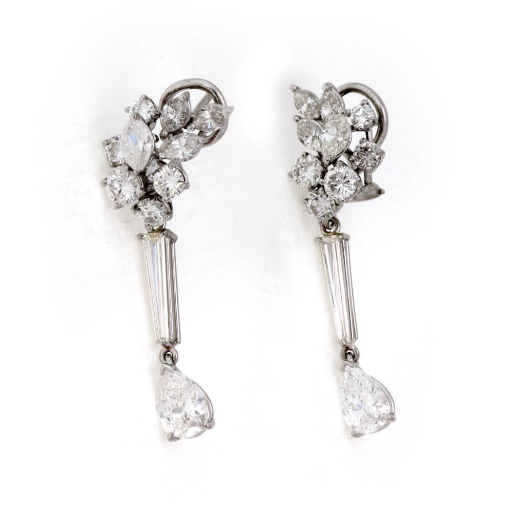 Platinum Diamond Cluster Long Dangle Earrings 6.33ct F-G Color: Platinum Diamond Cluster Long Dangle Earrings 6.33ct F-G Color Exquisite and sophisticated, this pair of long dangle earrings is crafted from luxurious platinum. The earrings feature a stunning cluste