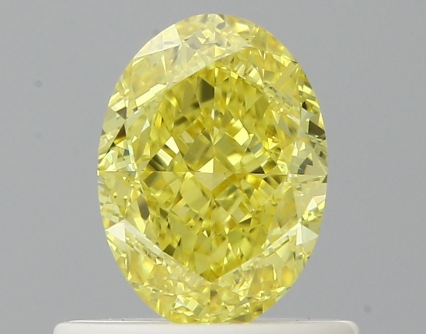 Loose Diamond - OVAL 0.7ct Fancy Vivid Yellow VVS2: Loose Diamond - OVAL 0.7ct Fancy Vivid Yellow VVS2 Source: Natural Shape: OVAL Carats: 0.7 Color: Fancy Vivid Yellow Certification: GIA Video: