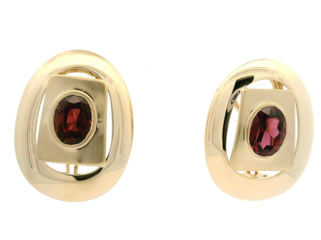 14k Yellow Gold Omega Back 5ctw Garnet Geometric Earrings: 14k Yellow Gold Omega Back 5ctw Garnet Geometric Earrings Discover the elegance of these 14k Yellow Gold Omega Back Earrings featuring large oval natural garnets. Each earring showcases a deep red gar