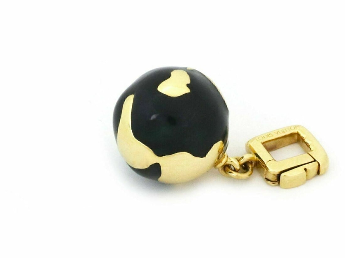 Louis Vuitton Globe Charm Pendant 18k Yellow Gold Enamel: Louis Vuitton Globe Charm Pendant 18k Yellow Gold Enamel This Louis Vuitton globe charm pendant is crafted in 18k yellow gold with enamel detailing and features a signed design with Louis Vuitton 750 