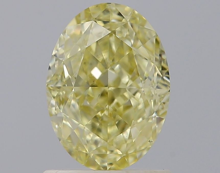 Loose Diamond - OVAL 1.23ct Fancy Light Yellow VS1: Loose Diamond - OVAL 1.23ct Fancy Light Yellow VS1 Source: Natural Shape: OVAL Carats: 1.23 Color: Fancy Light Yellow Certification: IGI Video: