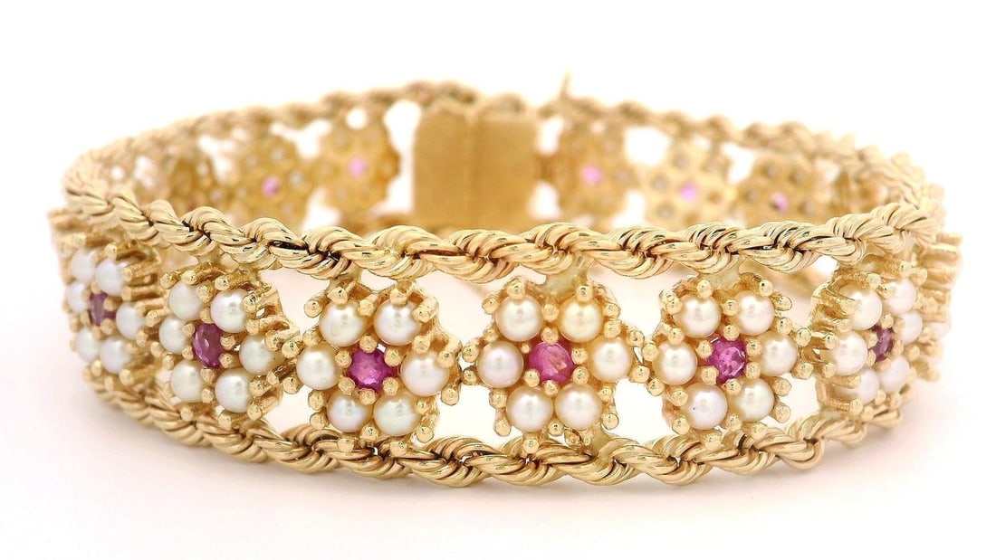 Vintage Yellow Gold Floral Pearl Ruby Cluster Bracelet 7.5": Vintage Yellow Gold Floral Pearl Ruby Cluster Bracelet 7.5" This exquisite vintage bracelet features a stunning cluster of genuine cultured pearls and rubies, elegantly arranged in a floral design wit