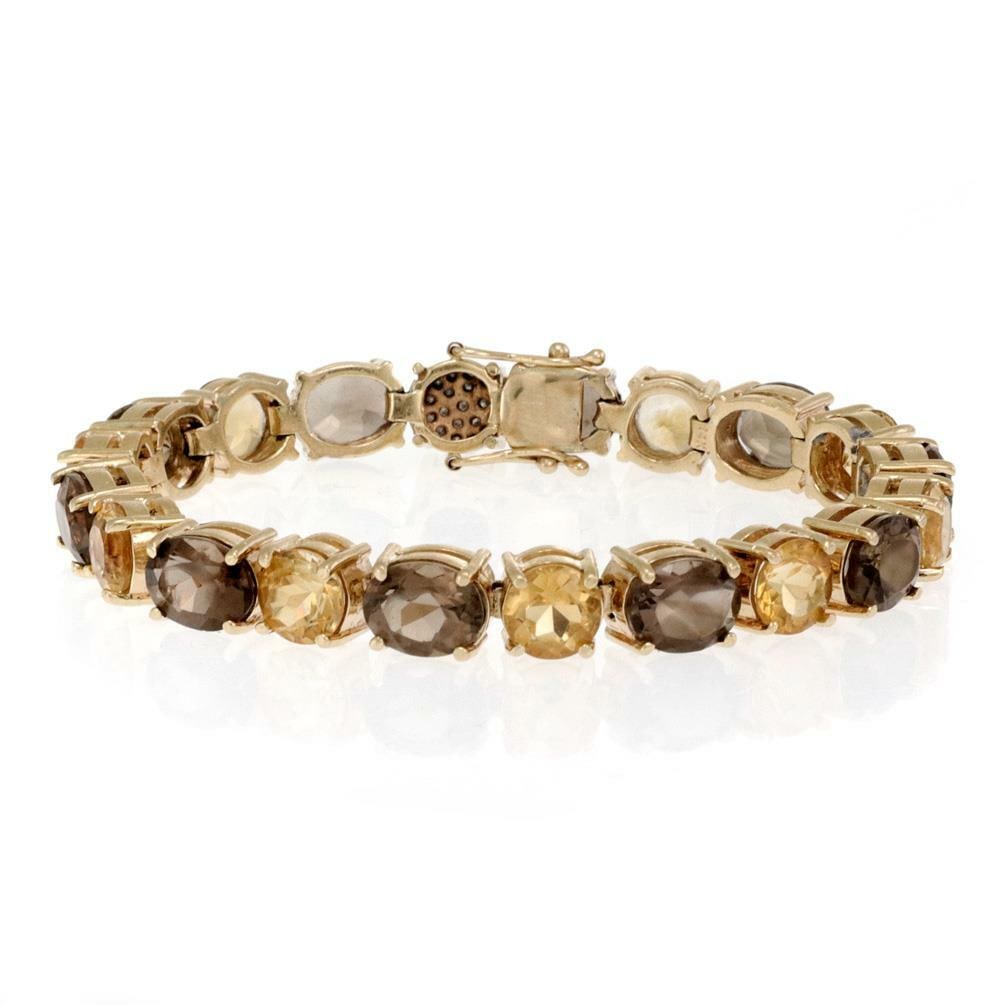 Vintage 55ct Citrine Smoky Quartz 14k Gold Bracelet with Diamonds: Vintage 55ct Citrine Smoky Quartz 14k Gold Bracelet with Diamonds This stunning vintage bracelet is a remarkable piece crafted from 14k yellow gold. It features a series of alternating oval and round 