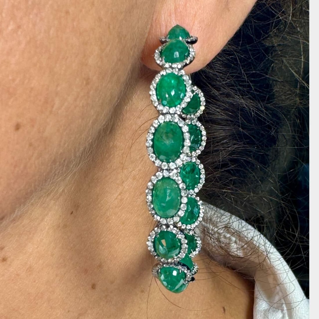 Elegant 18K White Gold Emerald Diamond Hoop Earrings 30 Ct Emeralds 4 Ct Diamonds: Elegant 18K White Gold Emerald Diamond Hoop Earrings 30 Ct Emeralds 4 Ct Diamonds Elevate your elegance with these stunning 18K White Gold Emerald & Diamond Hoop Earrings. Crafted from luxurious 18K w