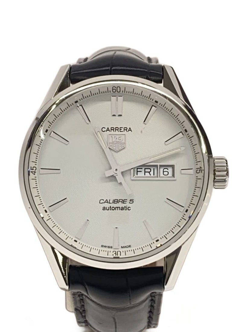 TAG Heuer Carrera Calibre 5 men's leather wristwatch: TAG Heuer Carrera Calibre 5 men's leather wristwatch This TAG Heuer Carrera Calibre 5 Day-Date wristwatch is designed for men and crafted in Switzerland. The watch features a leather band and has unde
