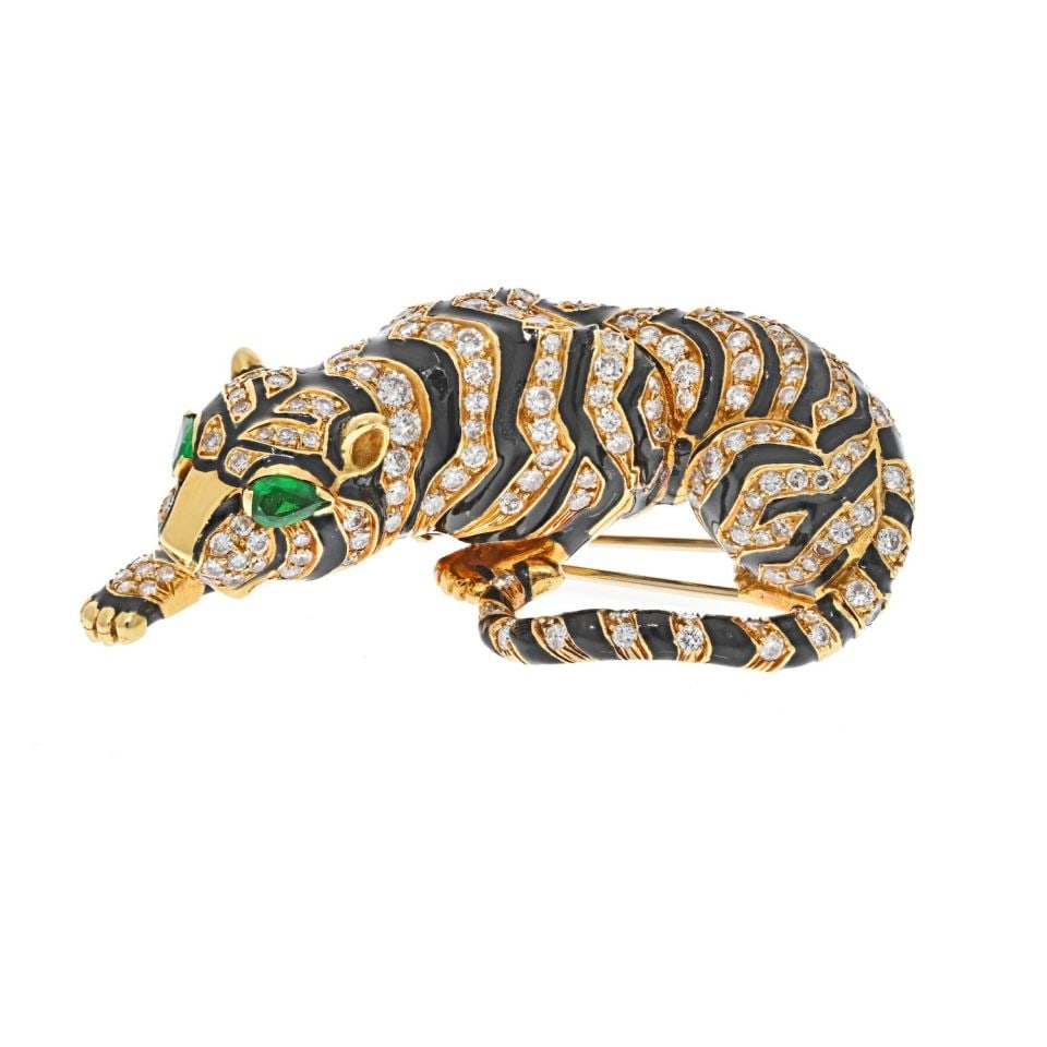 David Webb Platinum 18K Gold Tiger Brooch with Diamonds and Enamel: David Webb Platinum 18K Gold Tiger Brooch with Diamonds and Enamel This stunning brooch from David Webb's "Kingdom Collection" showcases a meticulously crafted tiger design. Made from a combination of