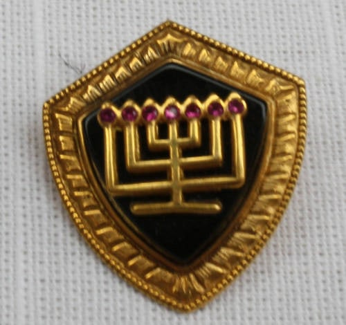 1900 Judaical Menora Brooch 14K Gold with Ruby Accents: 1900 Judaical Menora Brooch 14K Gold with Ruby Accents Presenting a stunning Judaical Menora brooch, crafted in 14K yellow gold and adorned with seven exquisite small rubies. This unique piece from 19