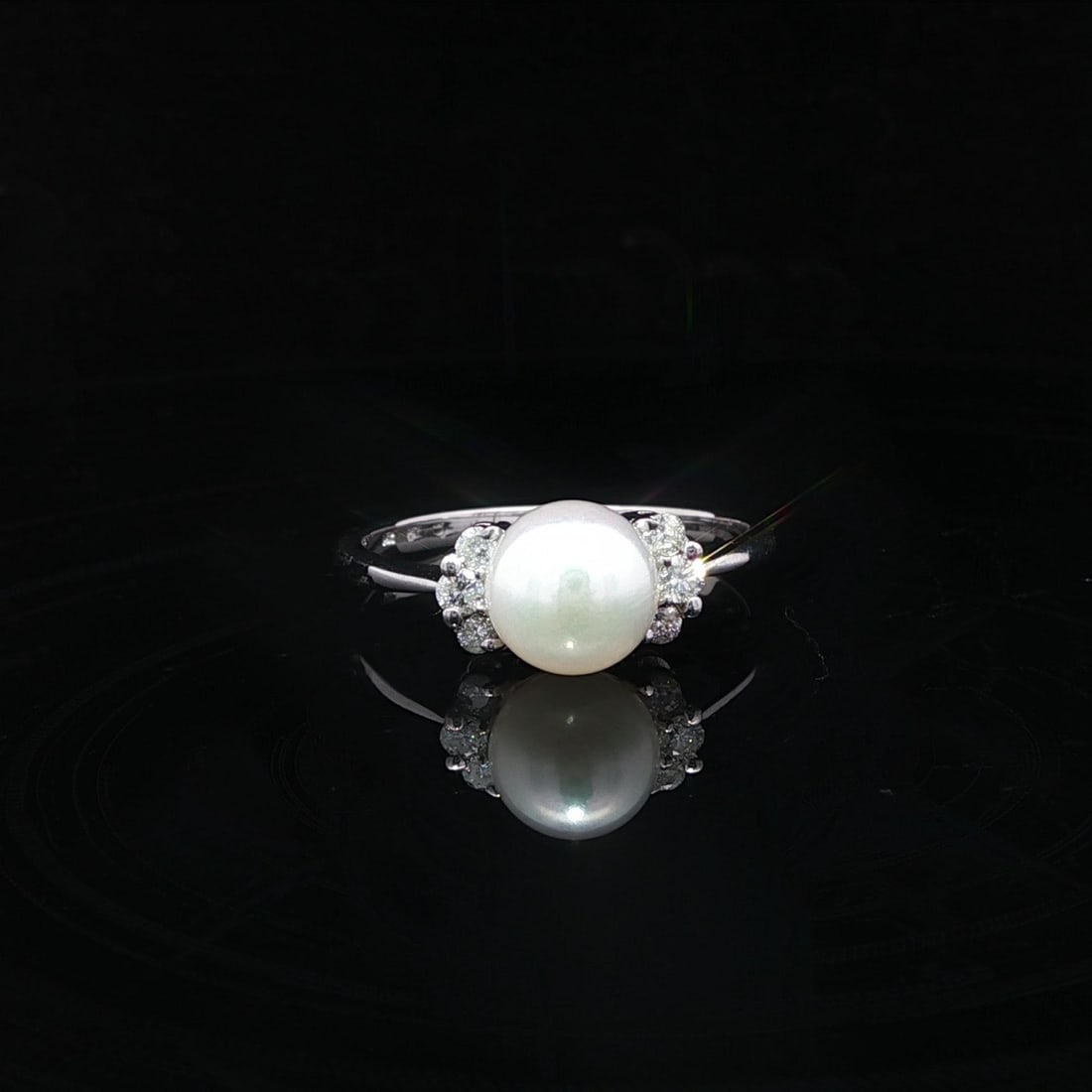 14k White Gold Dainty Ring with 7.1mm Pearl and 0.16ctw Diamonds: 14k White Gold Dainty Ring with 7.1mm Pearl and 0.16ctw Diamonds Presenting a stunning dainty ring crafted from solid 14k white gold, featuring a natural round cultured pearl measuring approximately 7