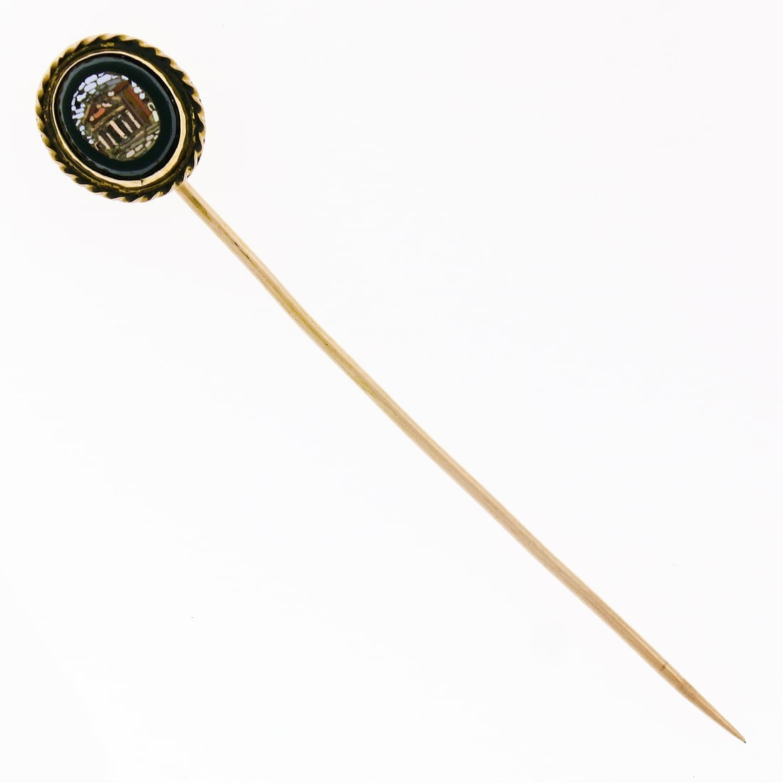 18K Yellow Gold Oval Black Onyx Micro Mosaic Stick Pin: 18K Yellow Gold Oval Black Onyx Micro Mosaic Stick Pin This antique stick pin is crafted from solid 18K yellow gold and features a bezel-set, oval-cut natural black onyx at its center. The onyx is fra